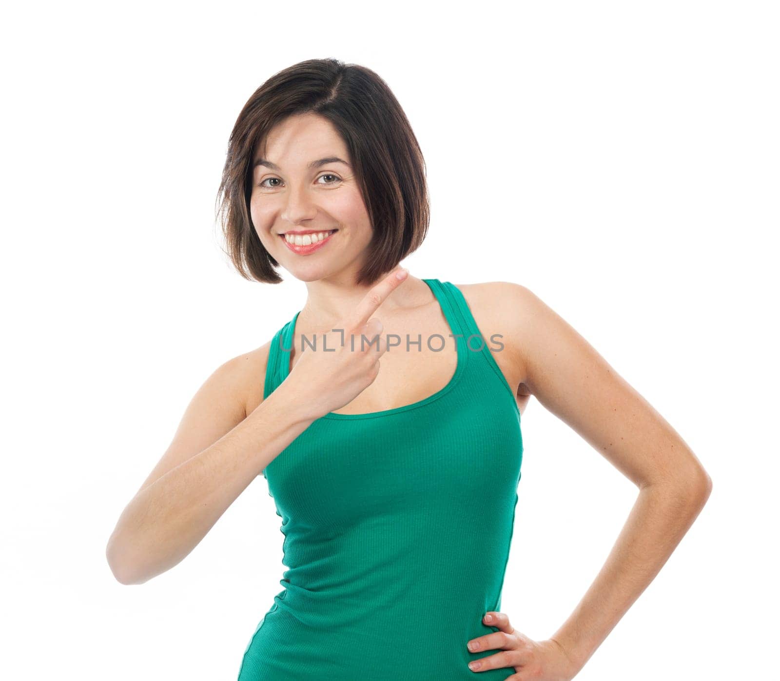 Beautiful brunette pointing up  isolated on white