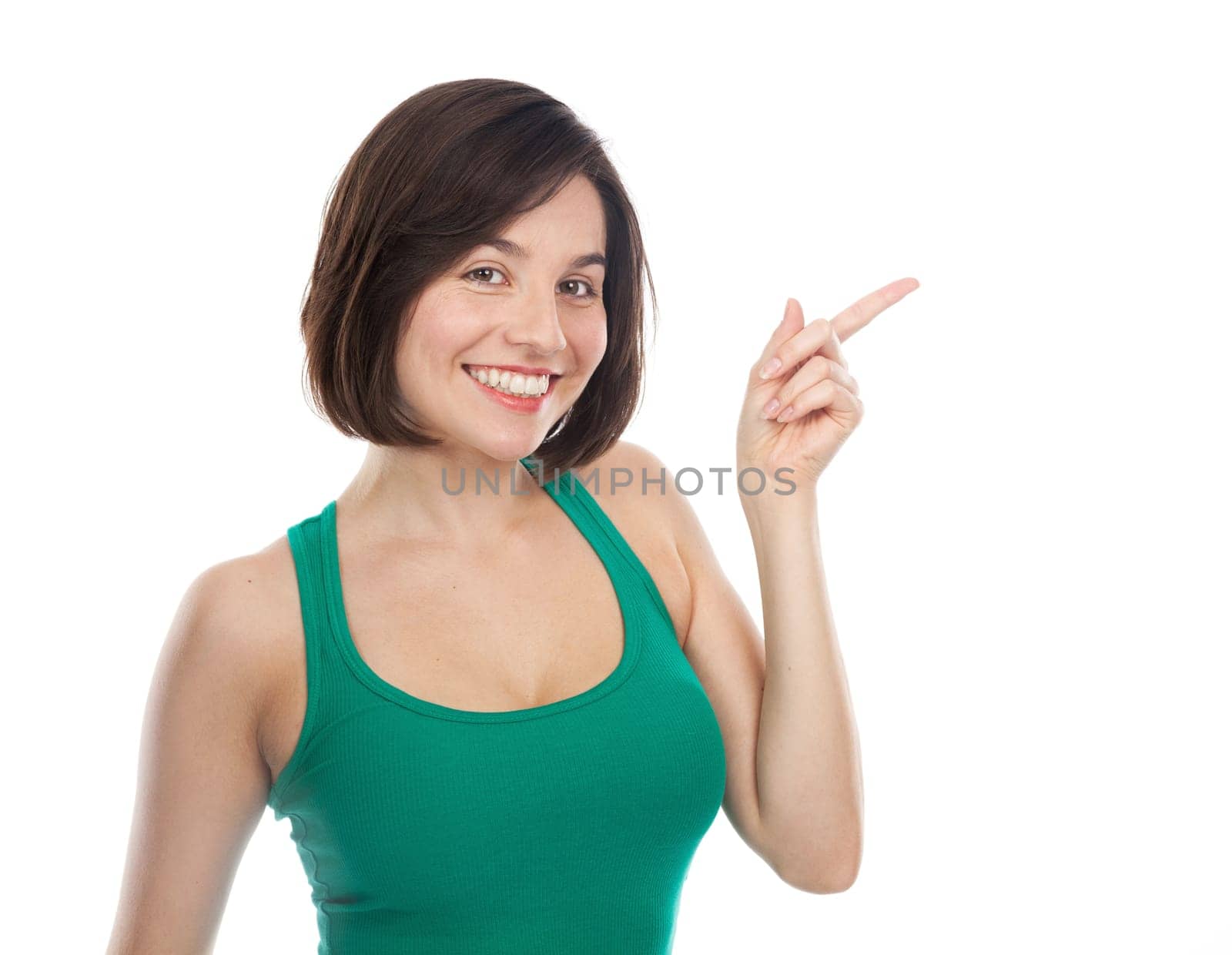 Joyful woman showing something with her finger, isolated on white