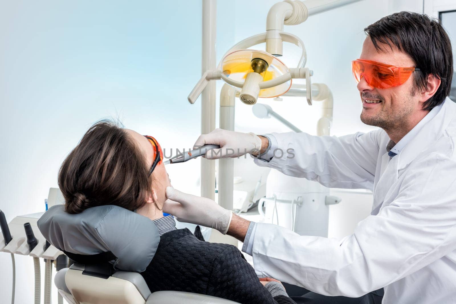 dentist at bleaching for more beautiful teeth