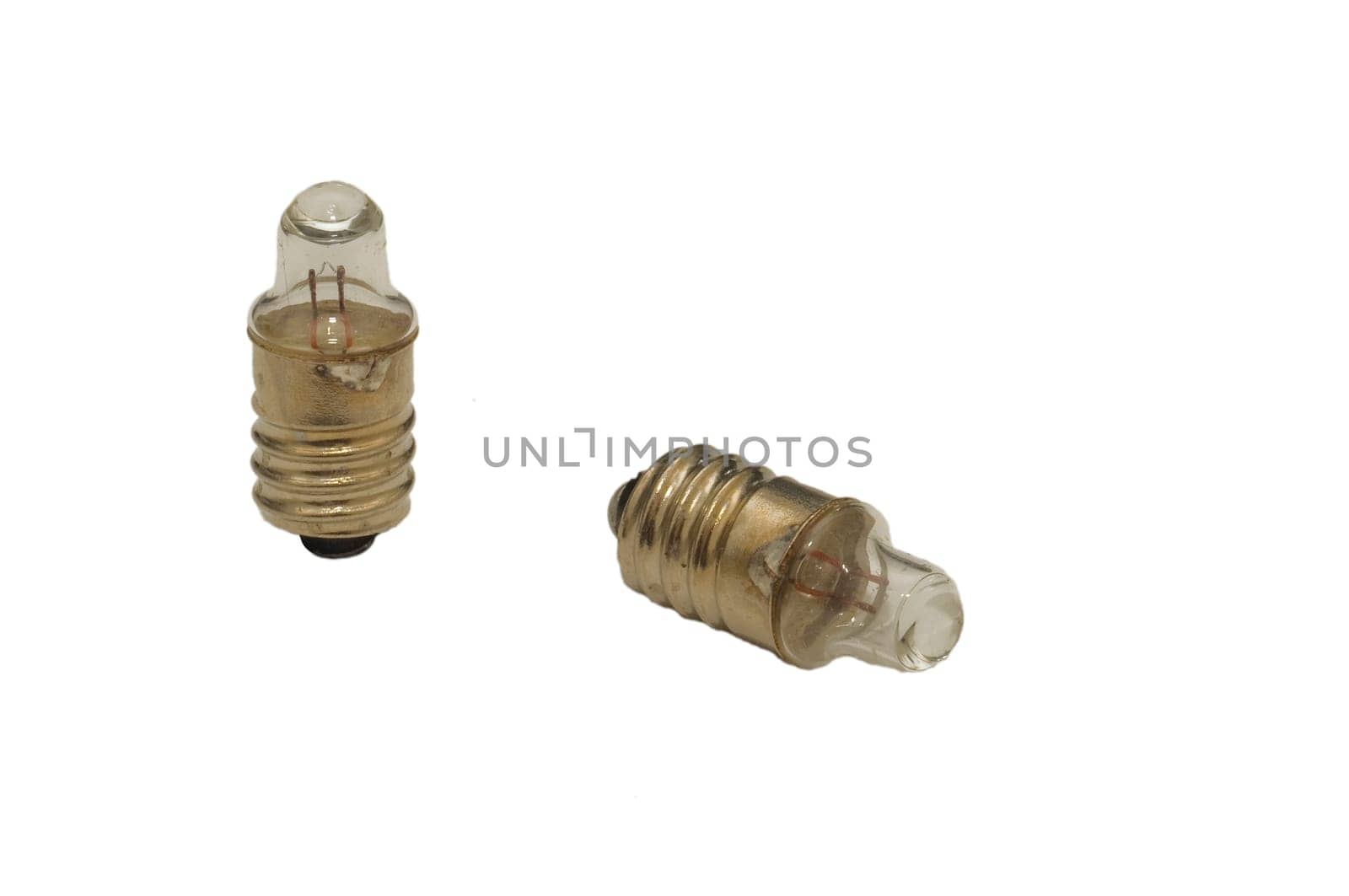 Two flashlight bulbs on white