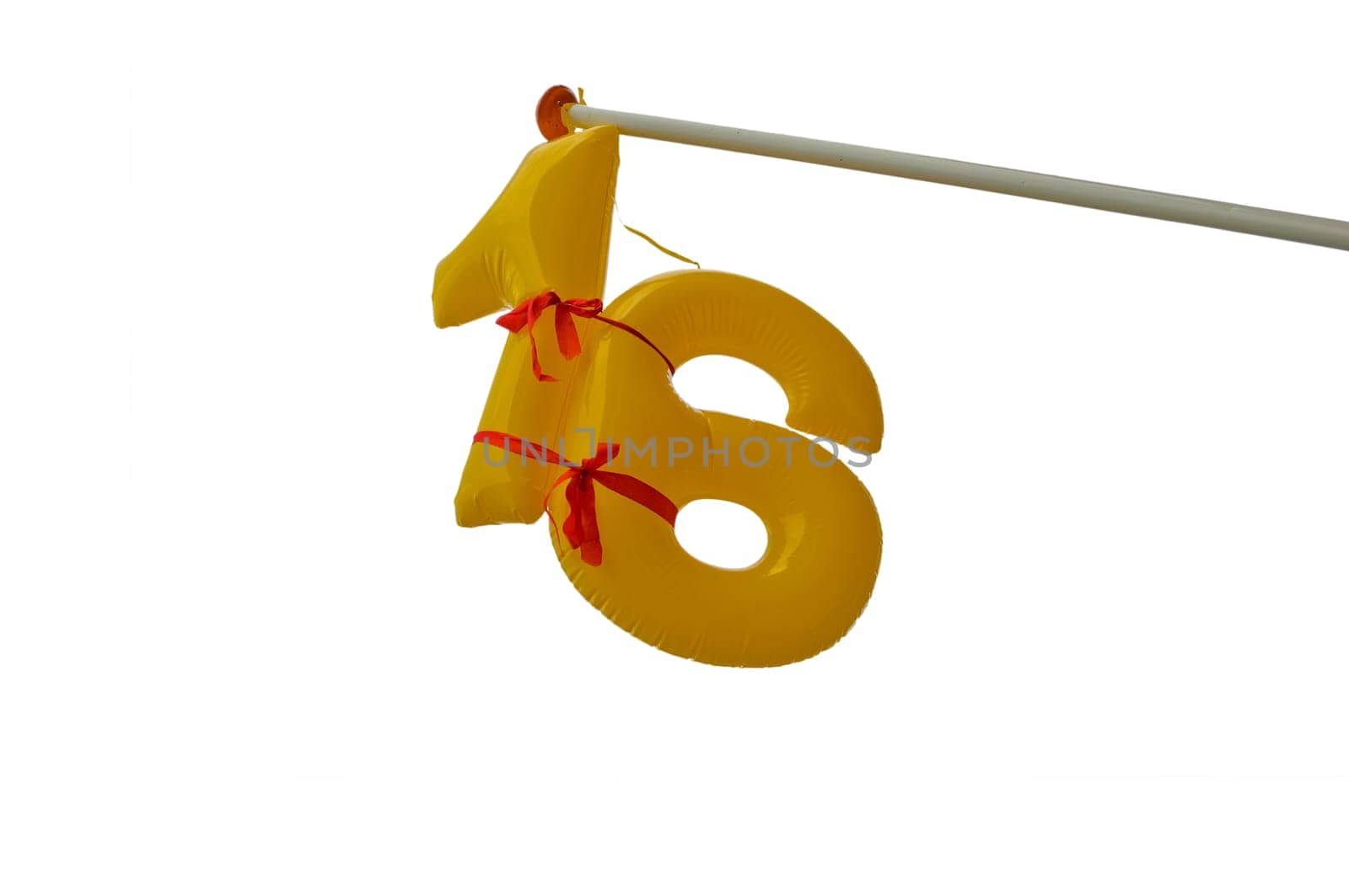 Inflatable number 16 on a flag pole.