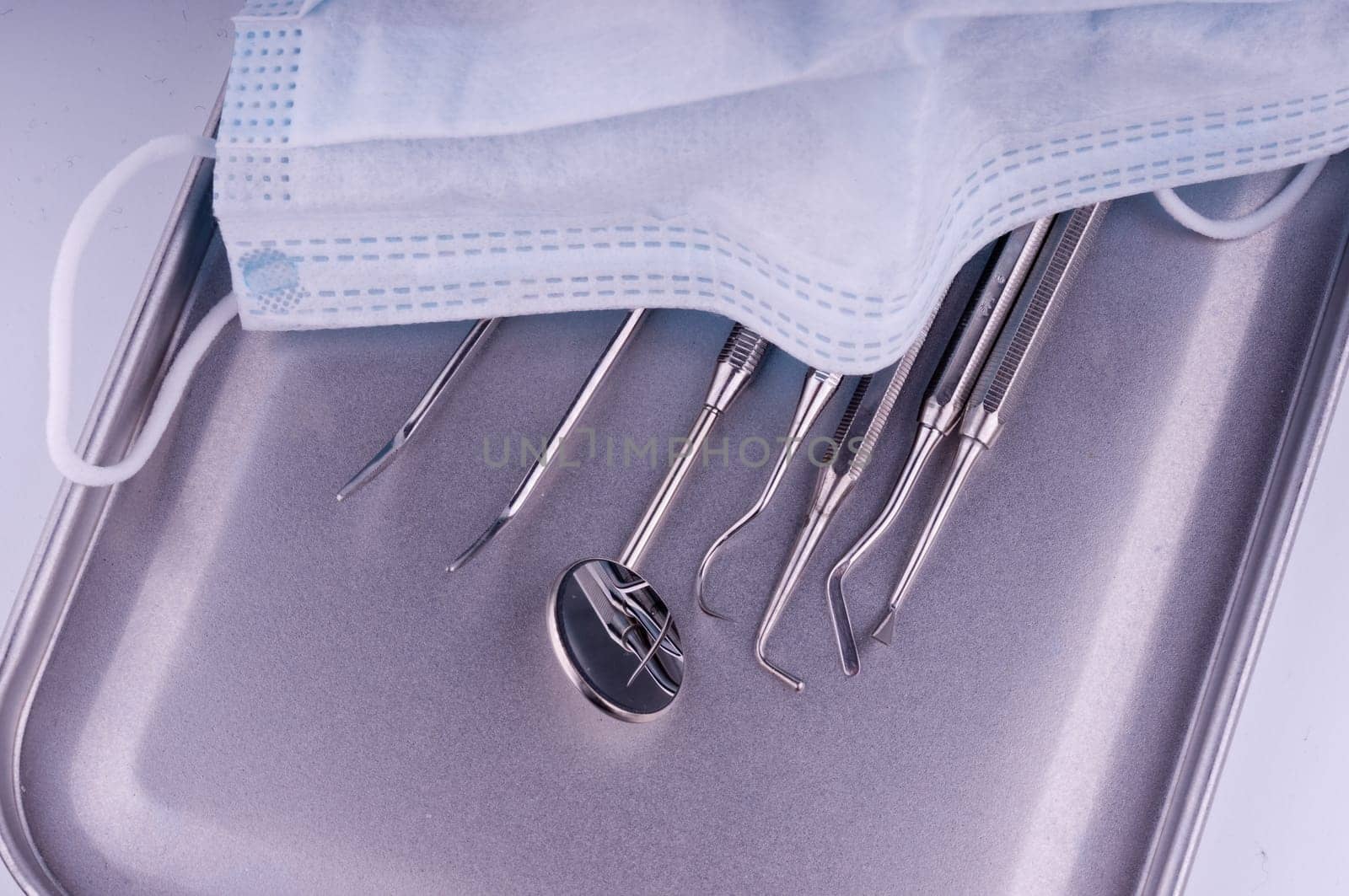 Dentist tools on metal tray