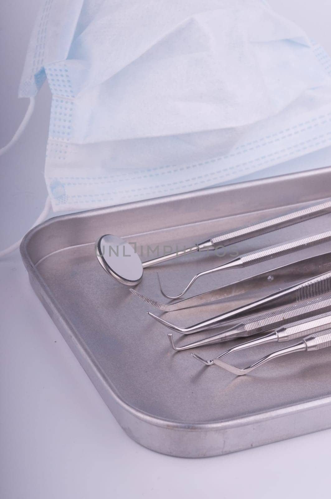 Dentist tools on metal tray