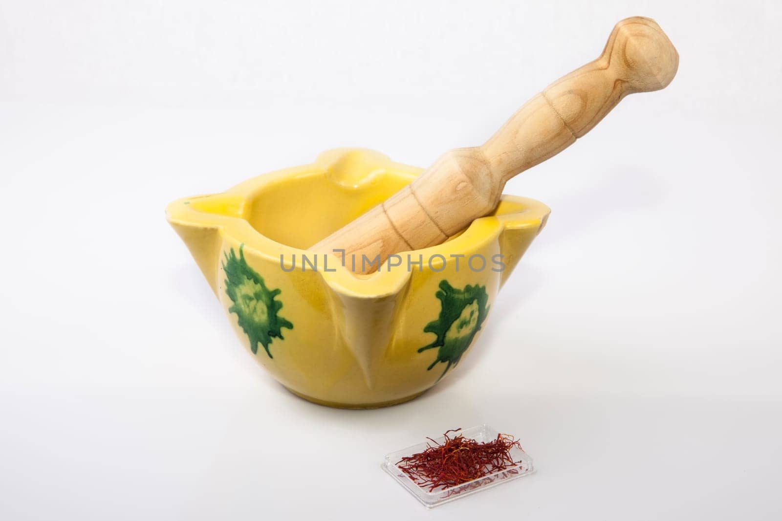 Clay mortar with spanish saffron Isolated on white background