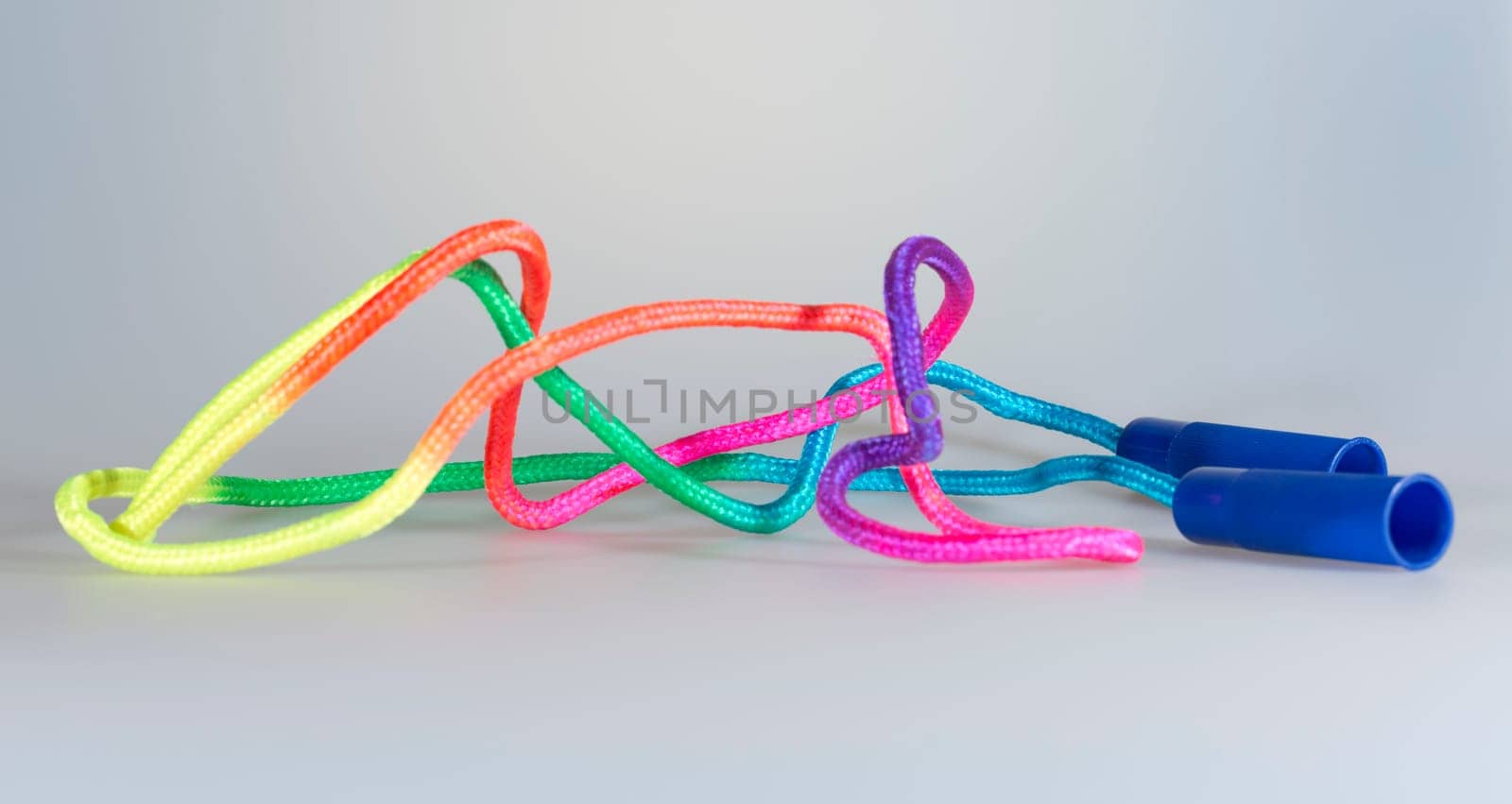 Colorful Skipping Rope on grey background.