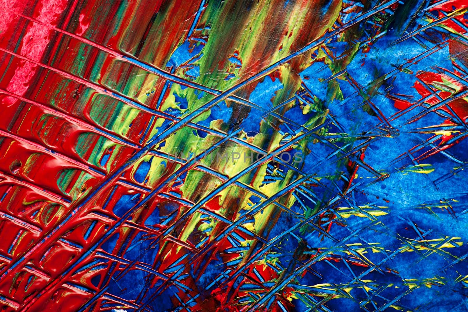 format-filling view of a surface dotted with colorful pasty colors and checkered scratch marks