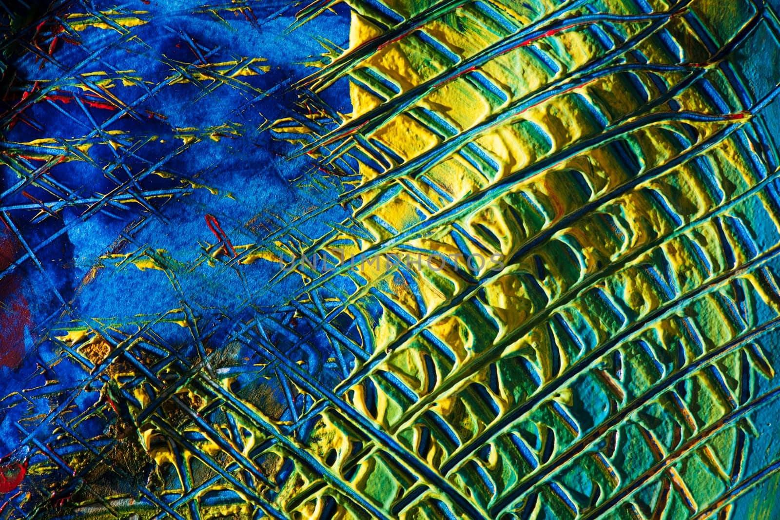 format-filling view of a surface dotted with colorful pasty colors and checkered scratch marks