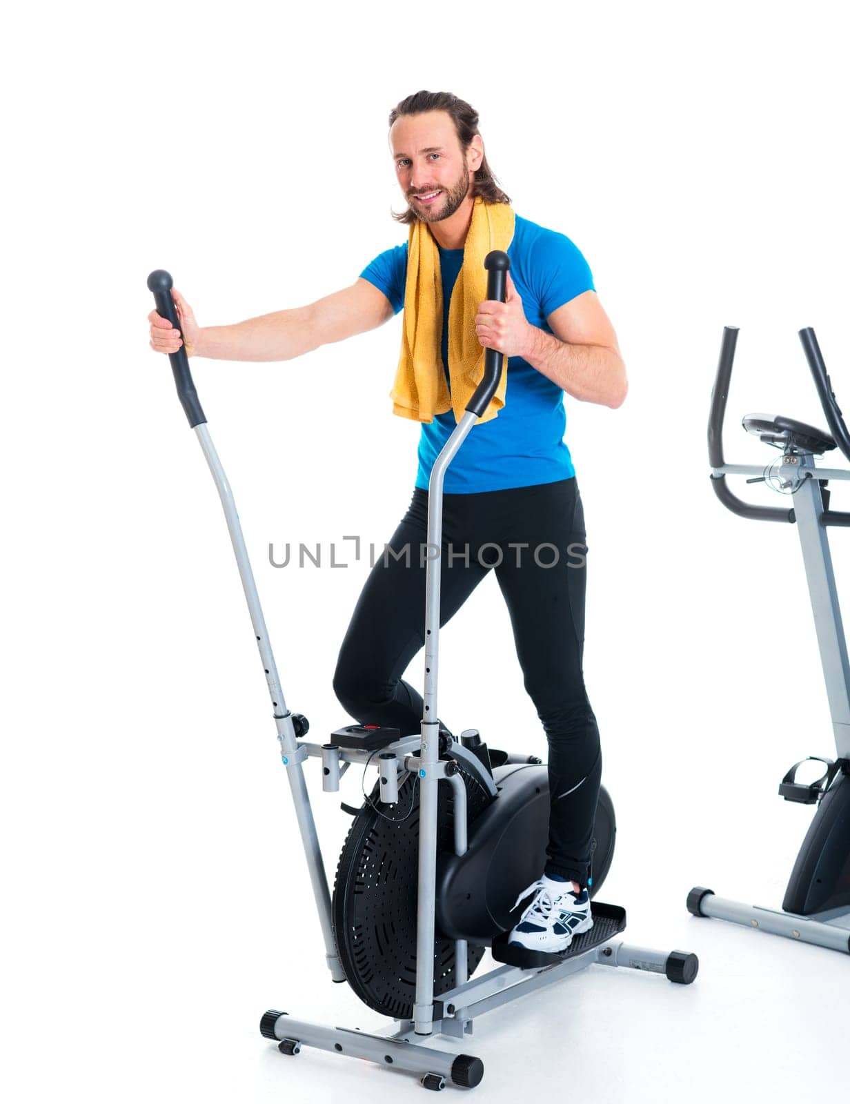 young man in blue shirt train with fitness machine