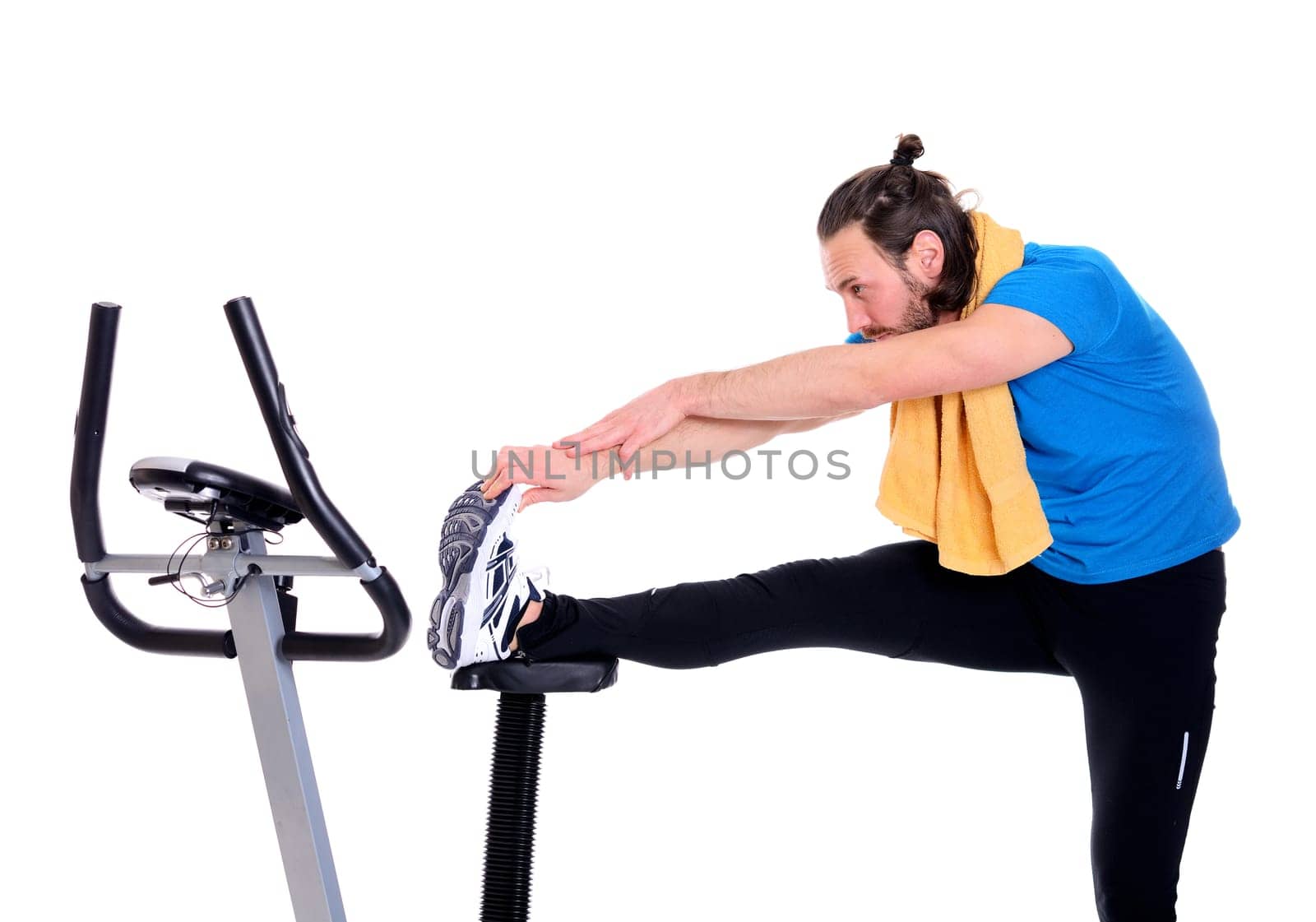 young man in blue shirt train with fitness machine