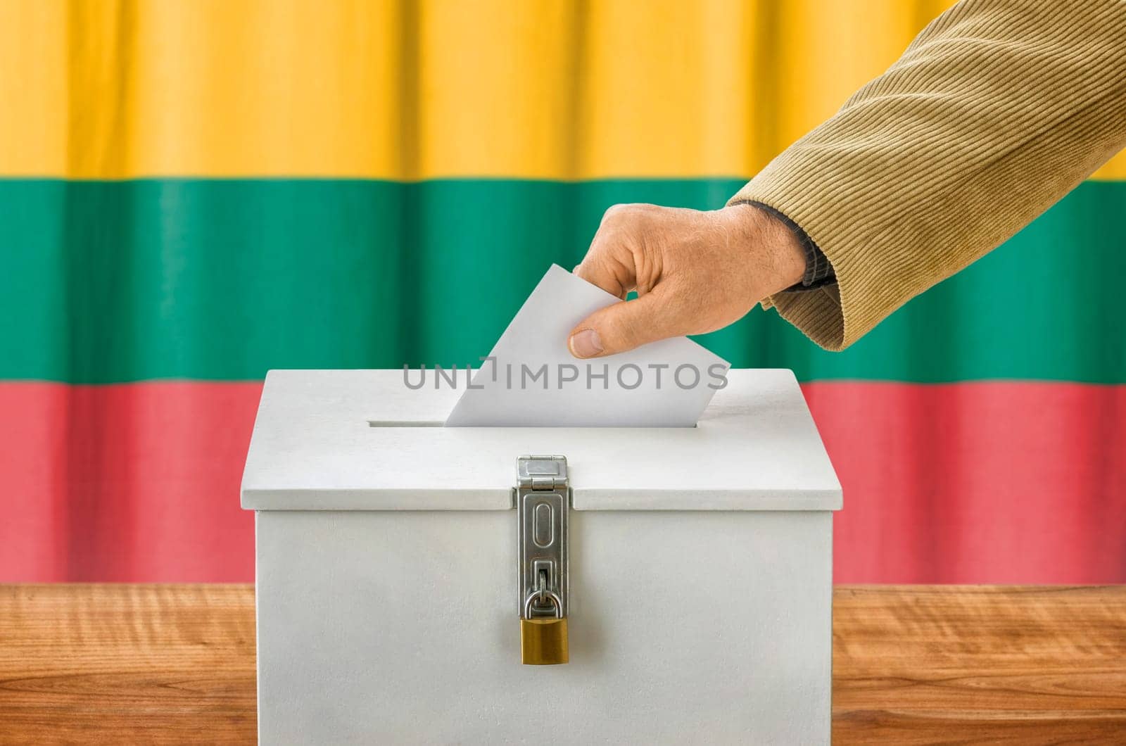 Man throws ballot papers into ballot box - Lithuania