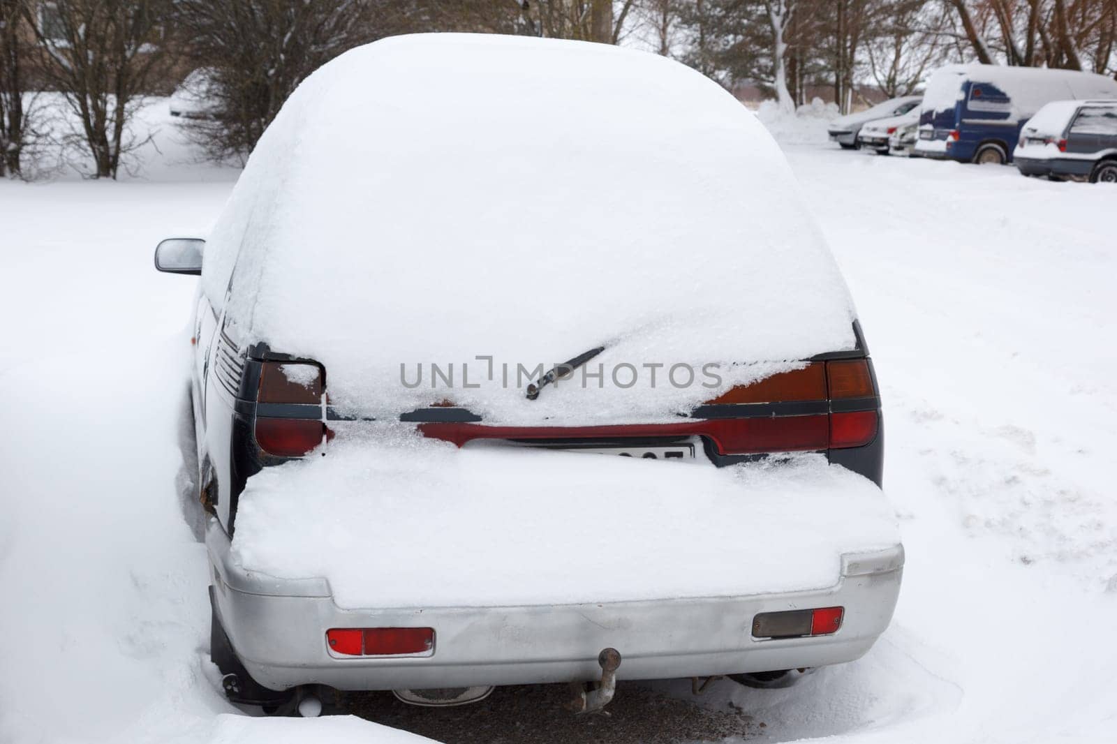 A car covered in a lot of snow