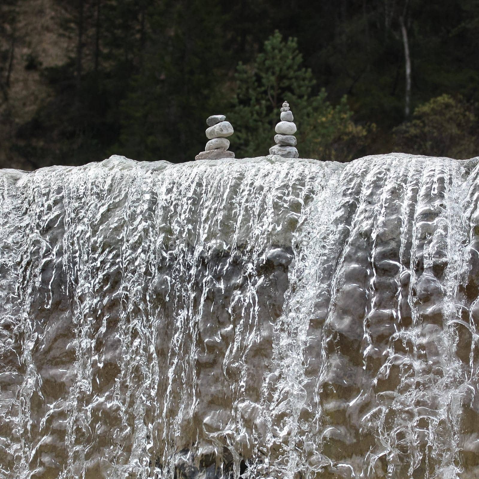 "Steinmanderl"" was built above a waterfall. Steinmanderl are the Bavarian term for stones stacked on top of each other on a stream."