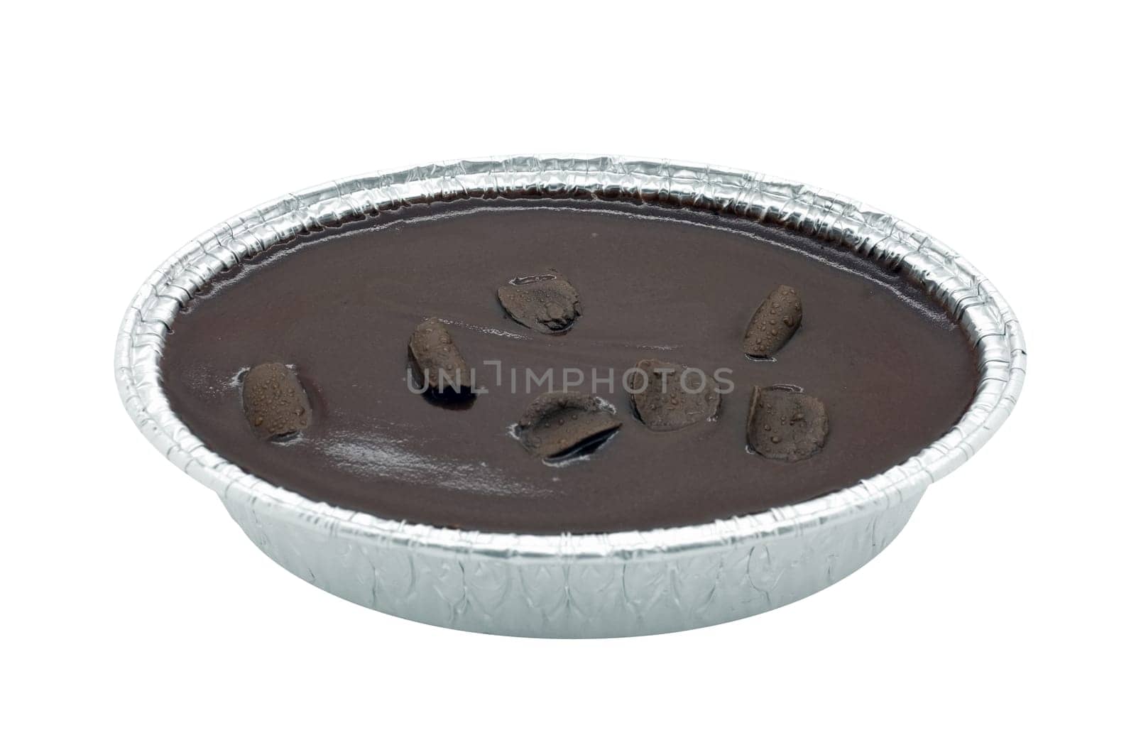 Chocolate cake in foil oval box isolated on white background