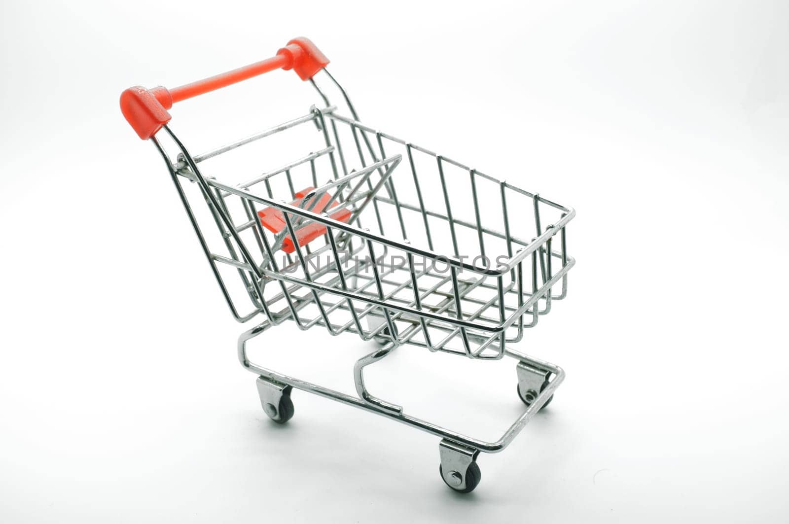 Empty shopping cart, side view, on white background
