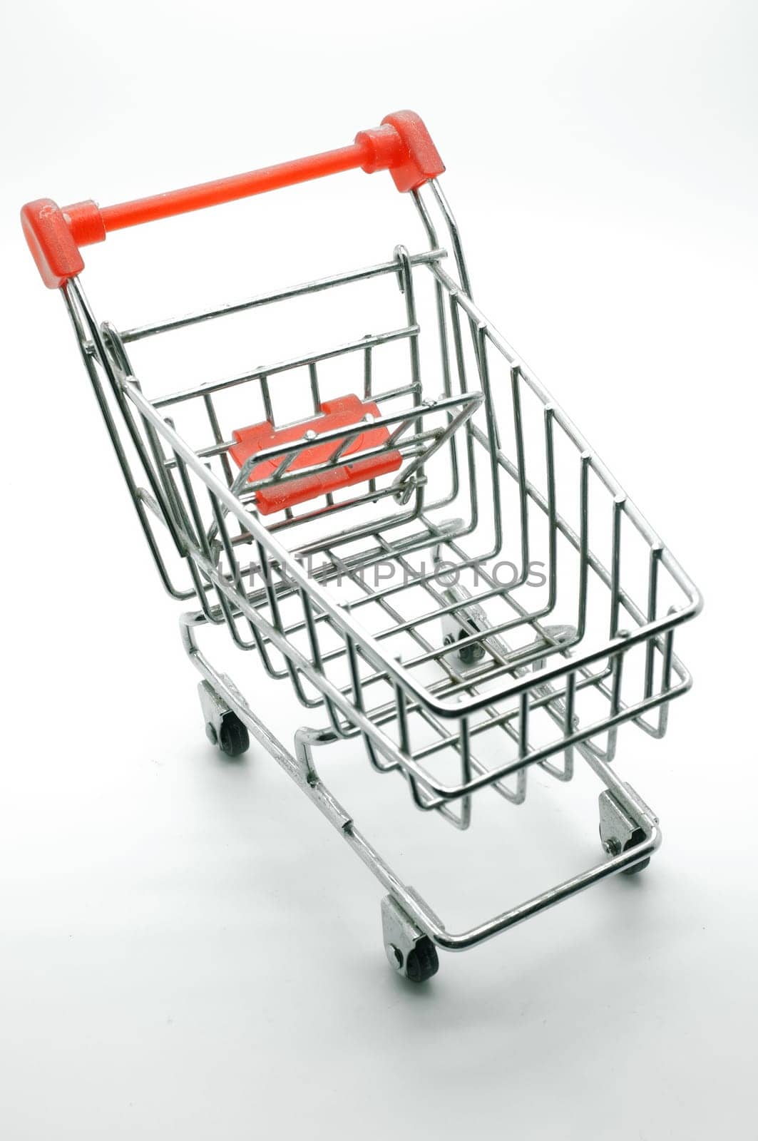Empty shopping cart, side view, on white background