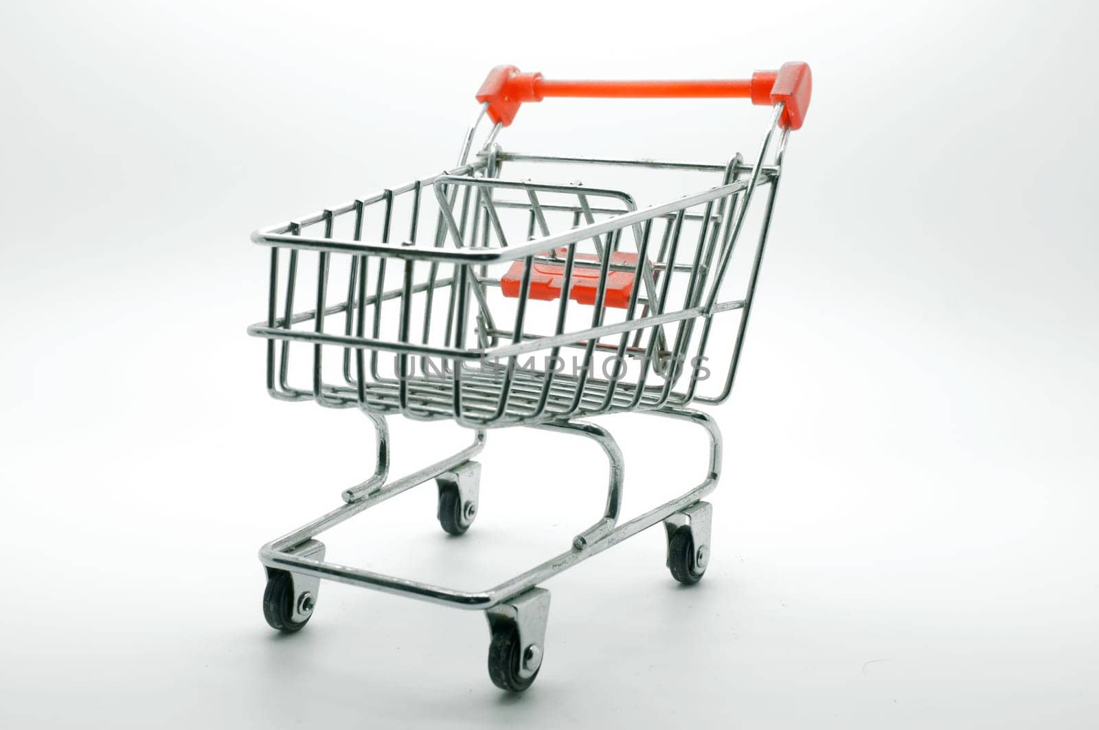 Empty shopping cart, side view, on white background