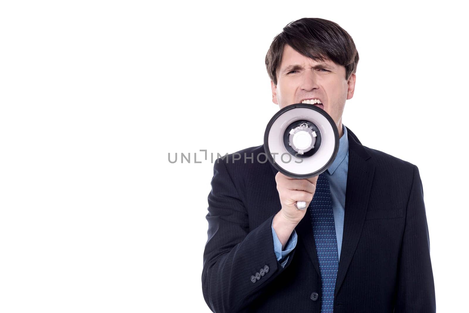Businessman screaming on a megaphone, isolated over white