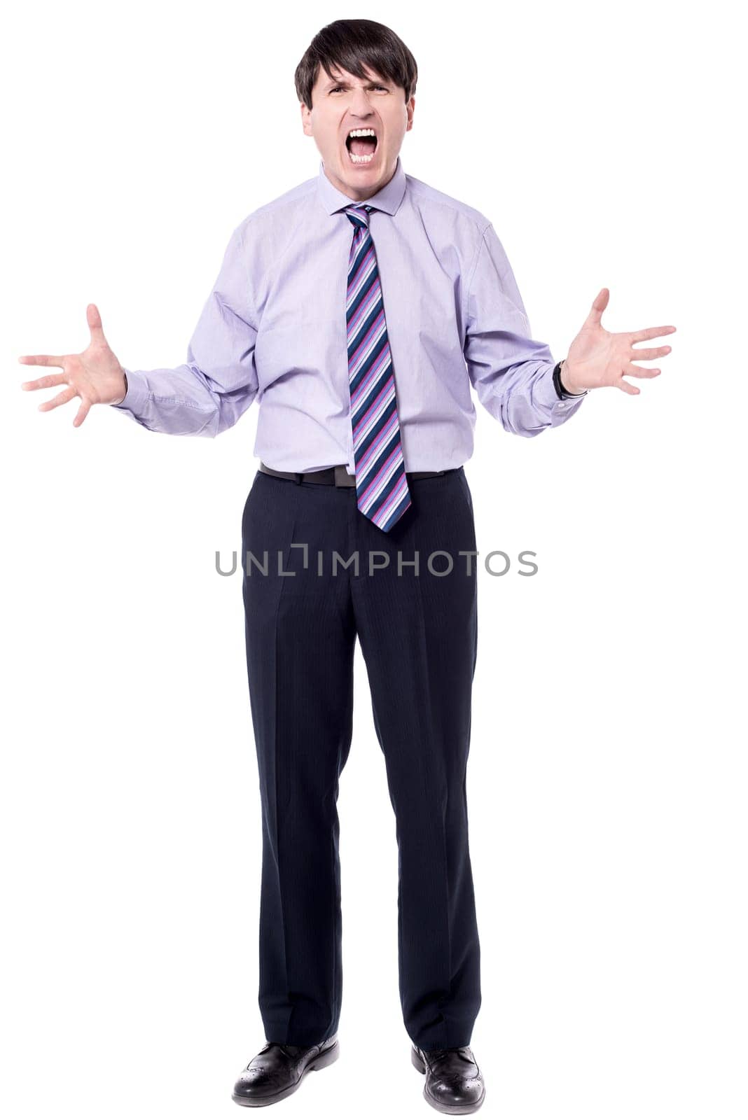Businessman shouting with anger on white background
