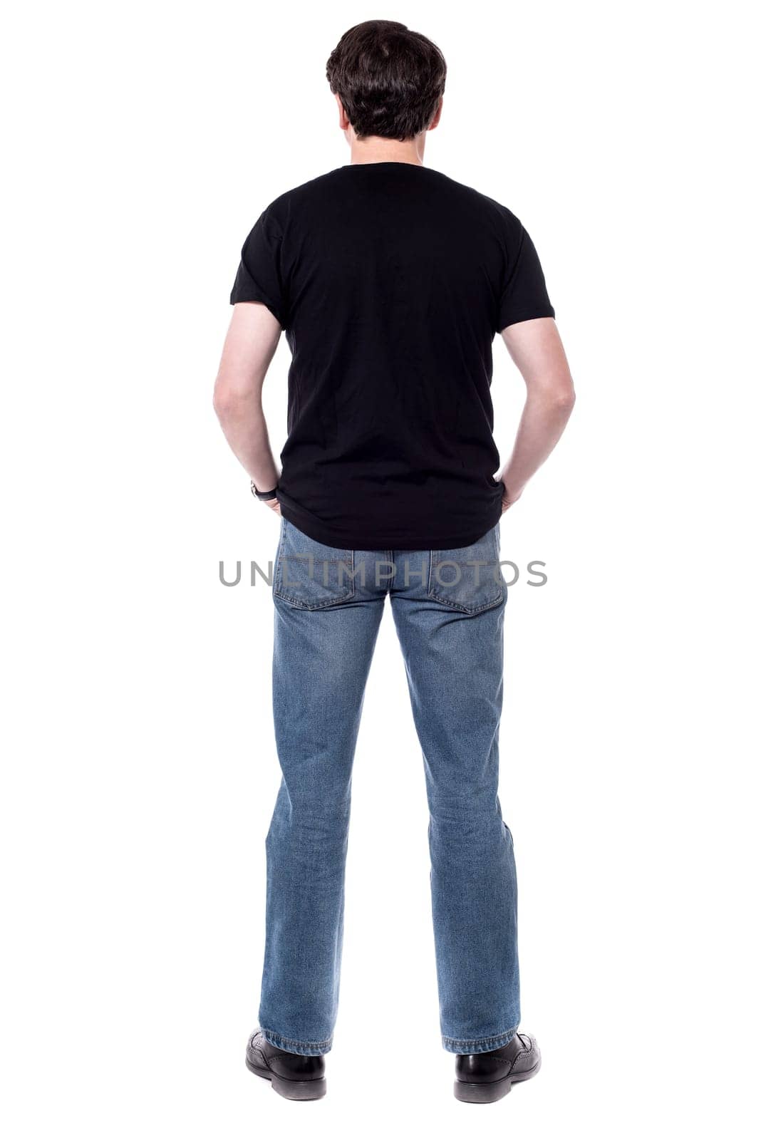 Back view of casual man, facing the wall
