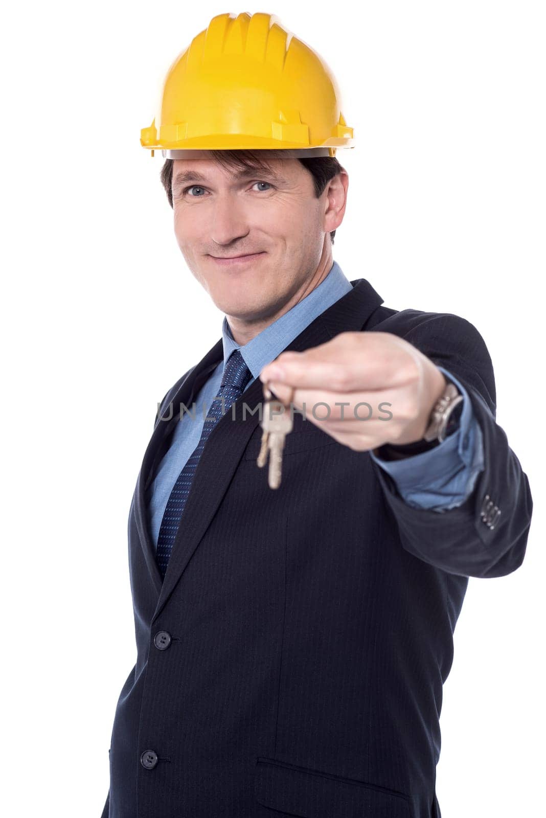 Male architect offering a new house key