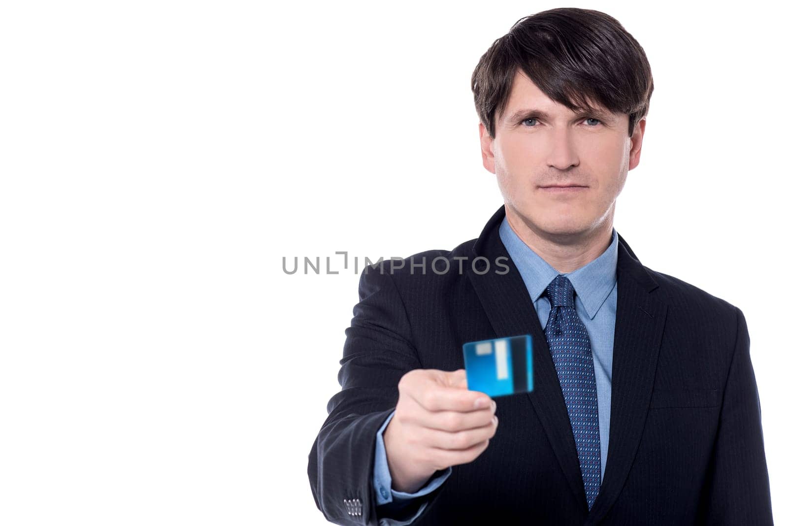 Male executive offering cash card over white