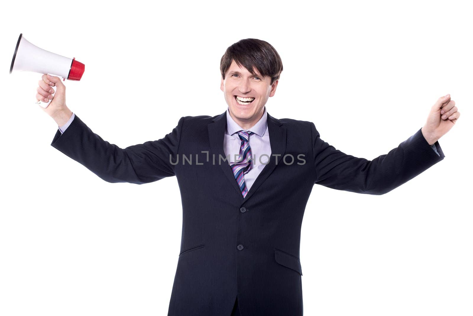 Successful businessman holding loudhailer with open arms