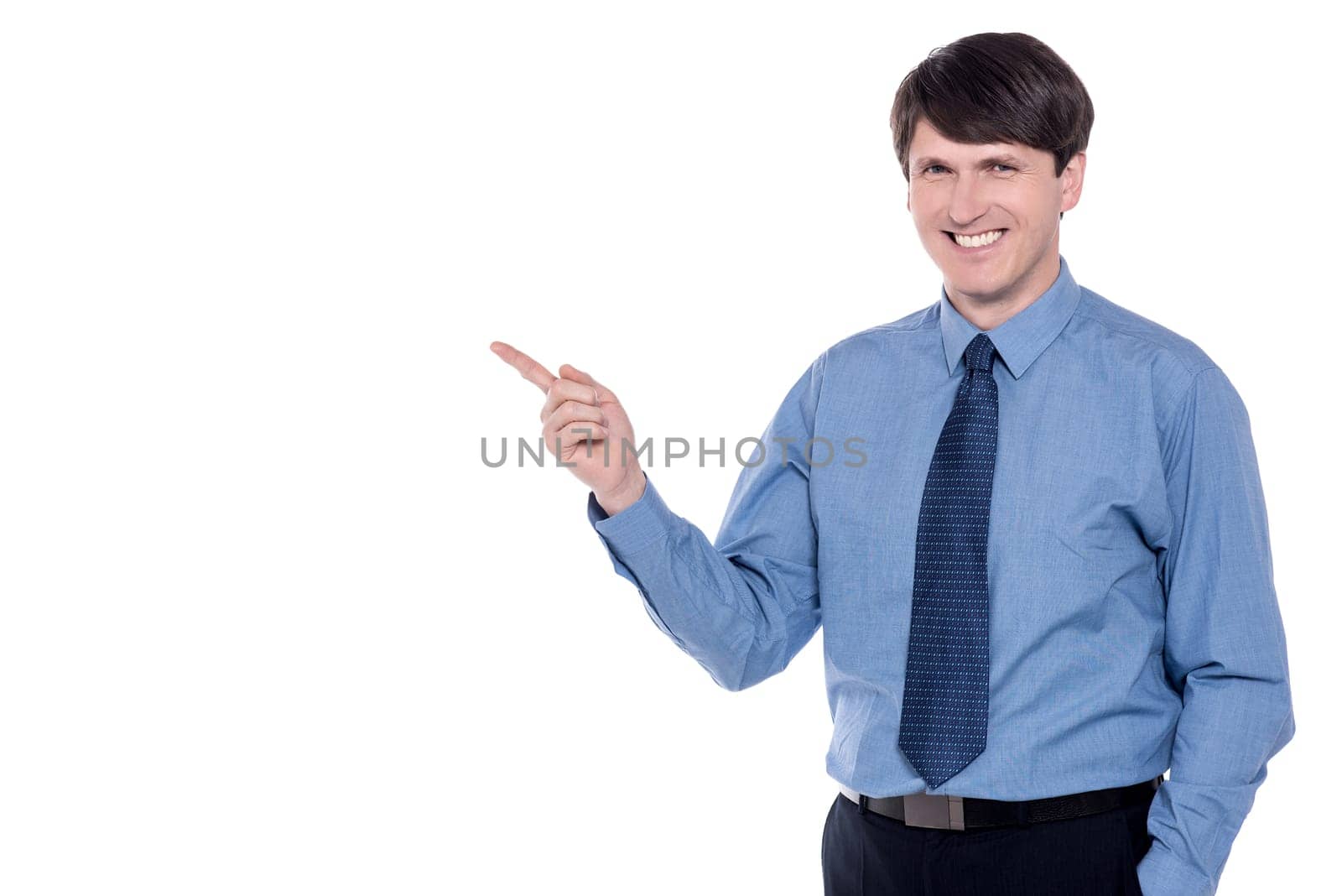 Businessman pointing his index finger at copy space