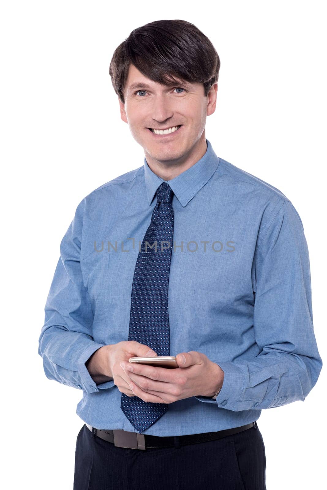 Smiling executive posing with his smart phone