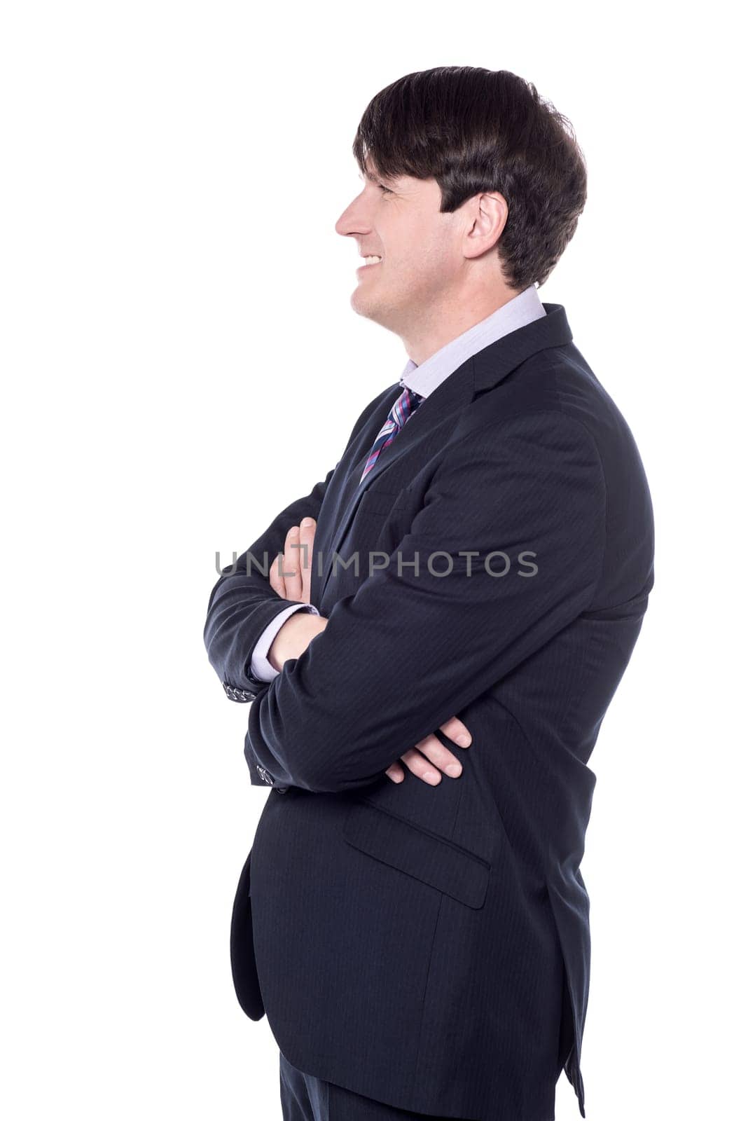 Side shot of a businessman with folded arms