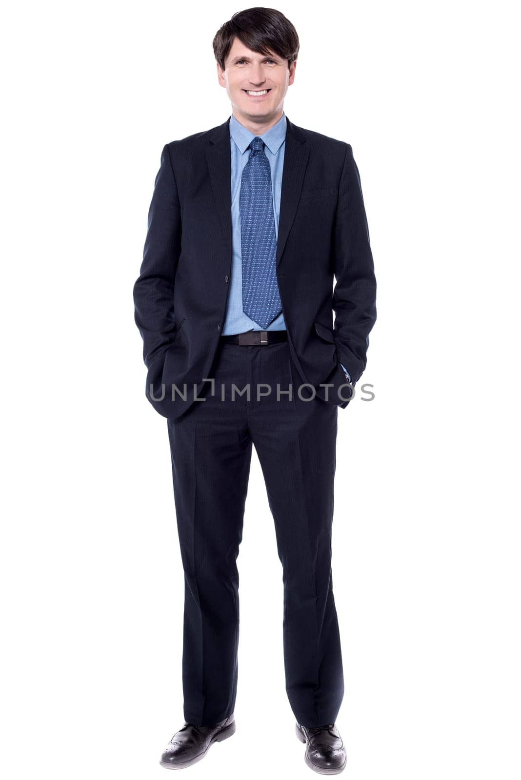 Confident entrepreneur with his hands in pockets