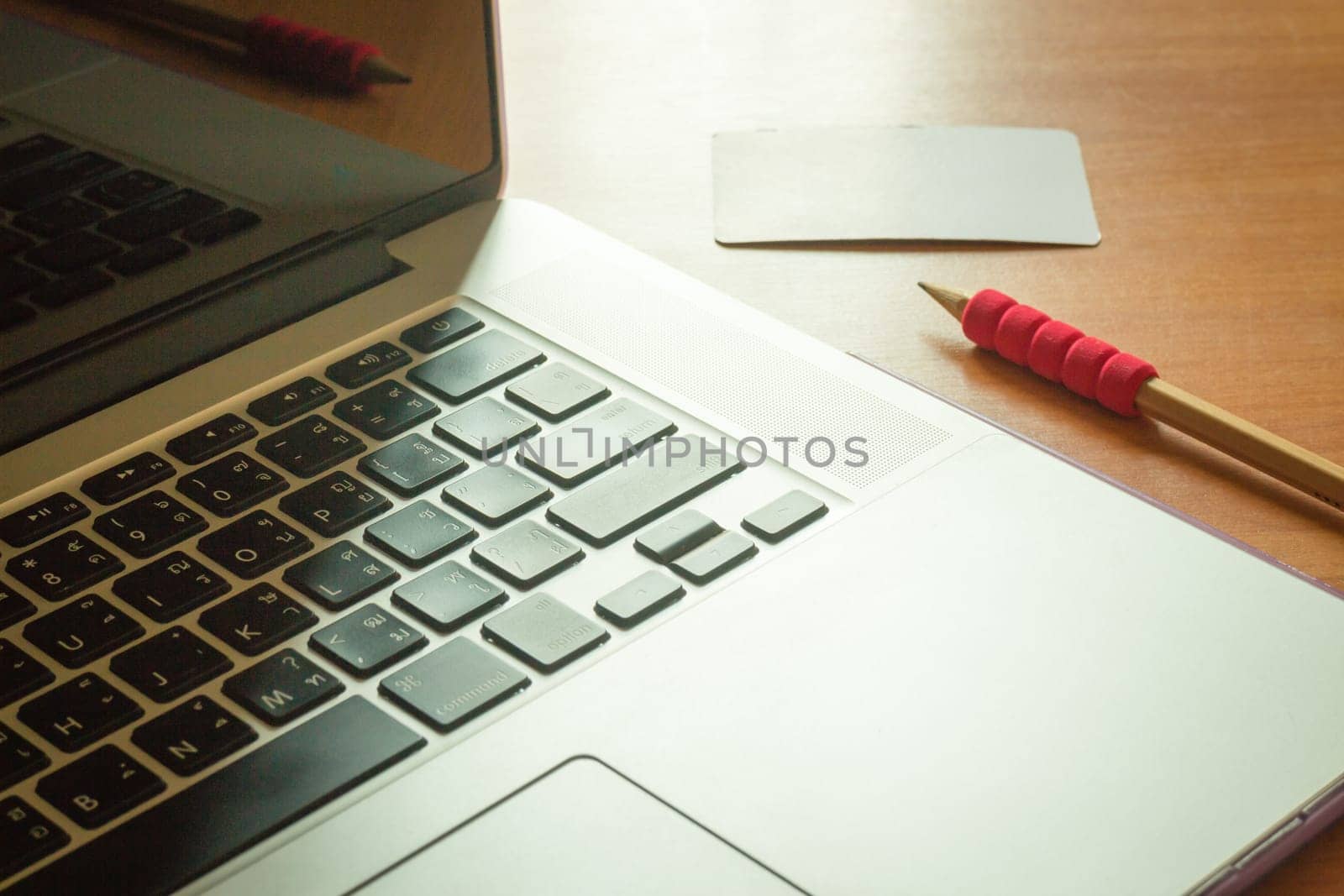 Simply freelance work table with laptop, stock photo