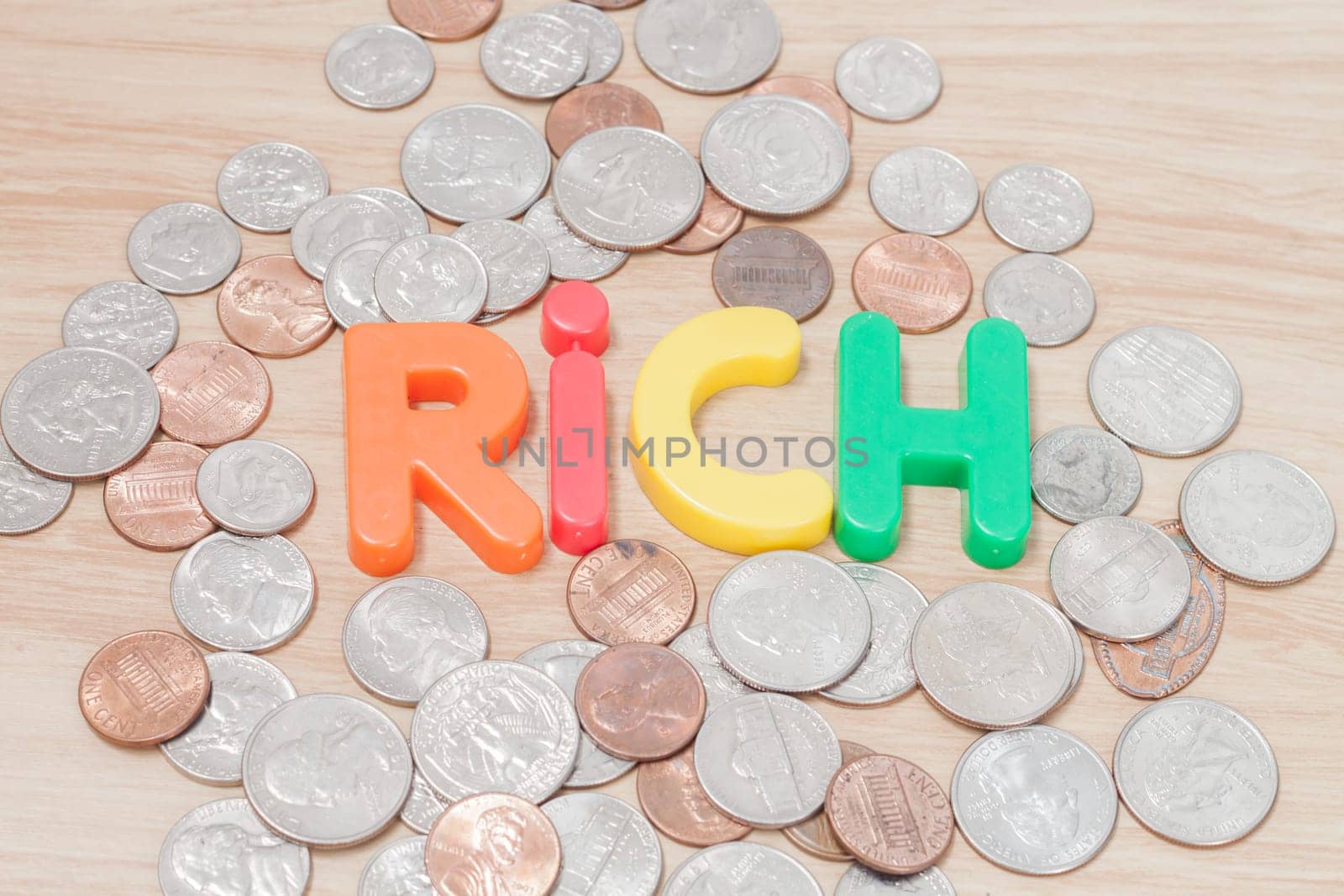 Rich alphabet with various US coins, stock photo