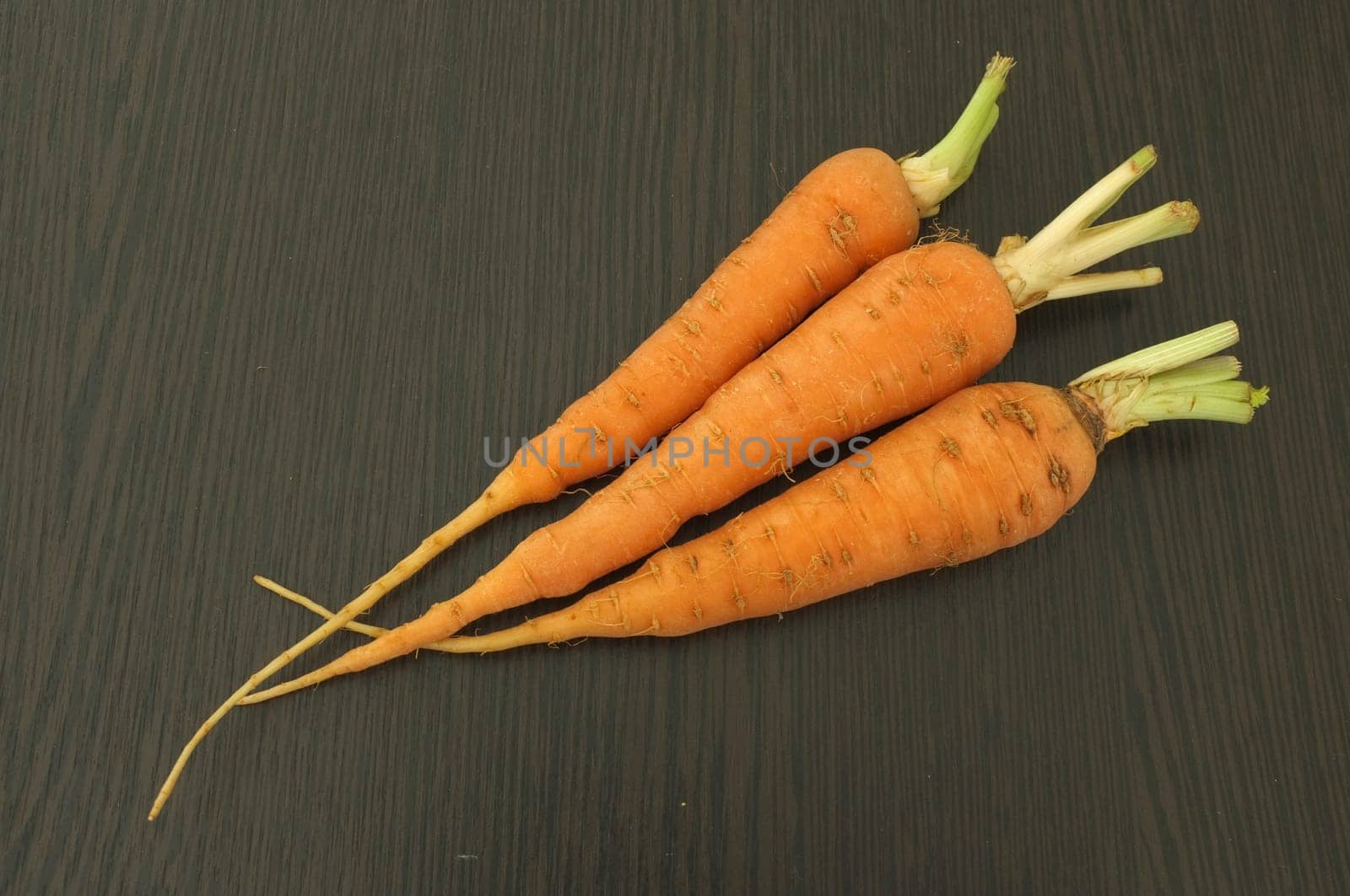 Carrot on wooden background