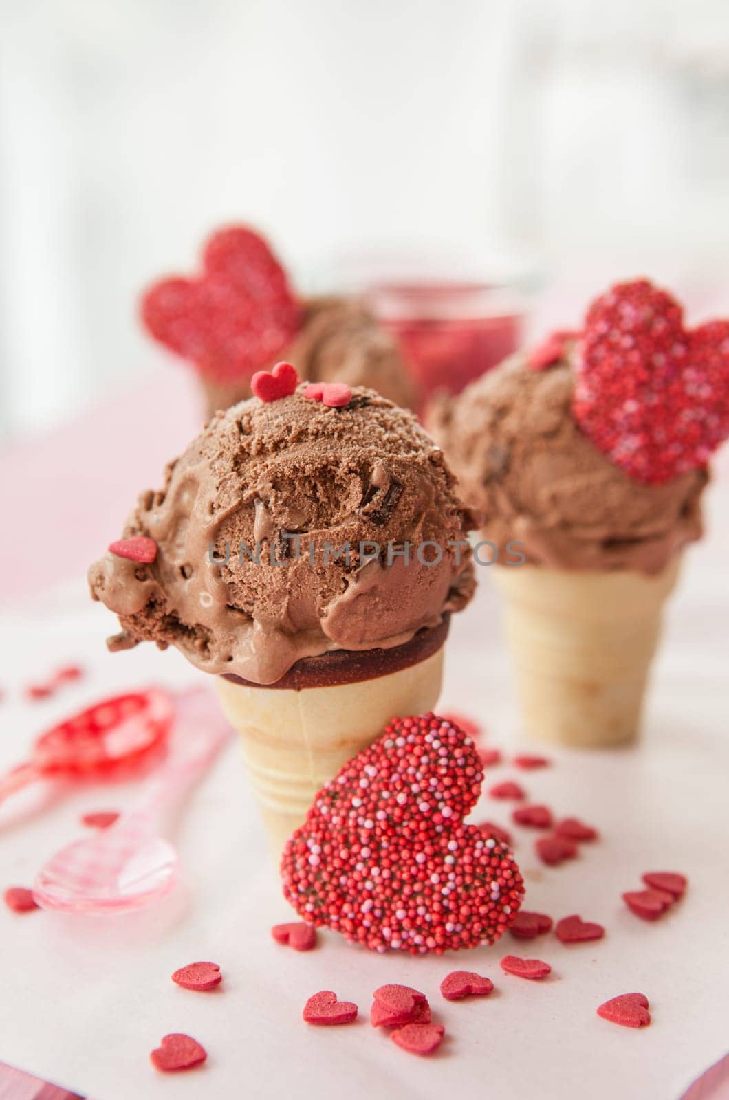 Chocolate ice cream in balls in small waffle cups