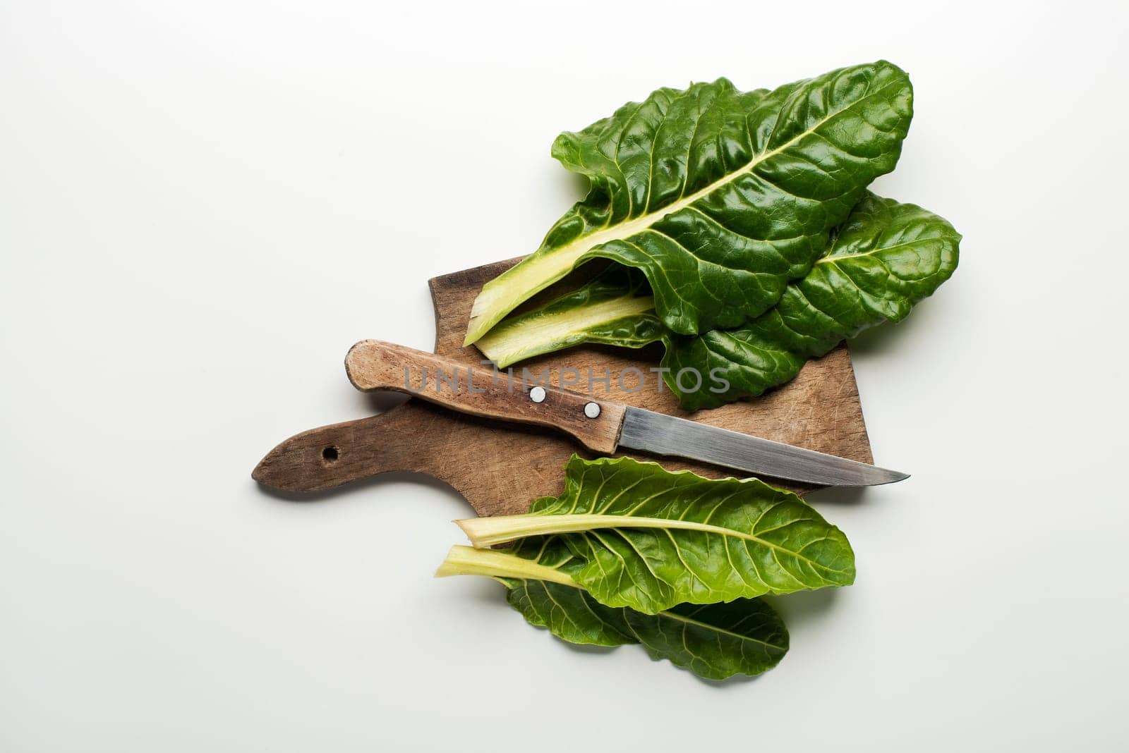 Fresh swiss chard leaves isolated on a white background.