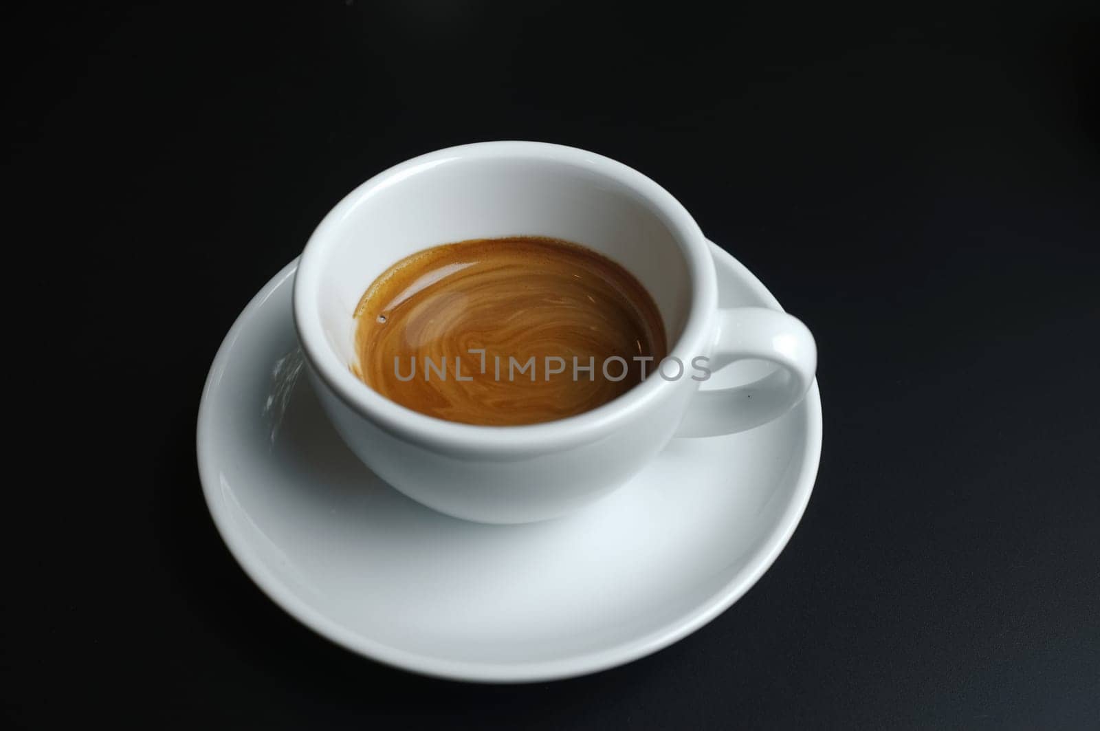 Hot coffee in white cup isolated on white background