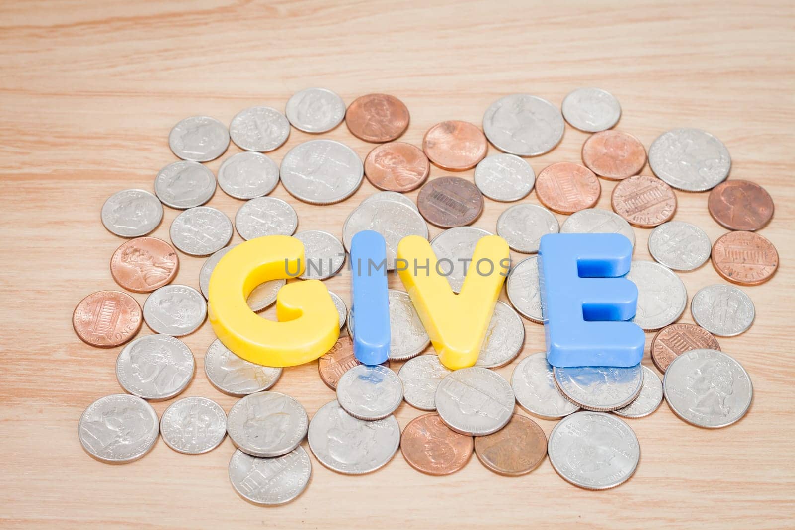 Give alphabet with various US coins, stock photo