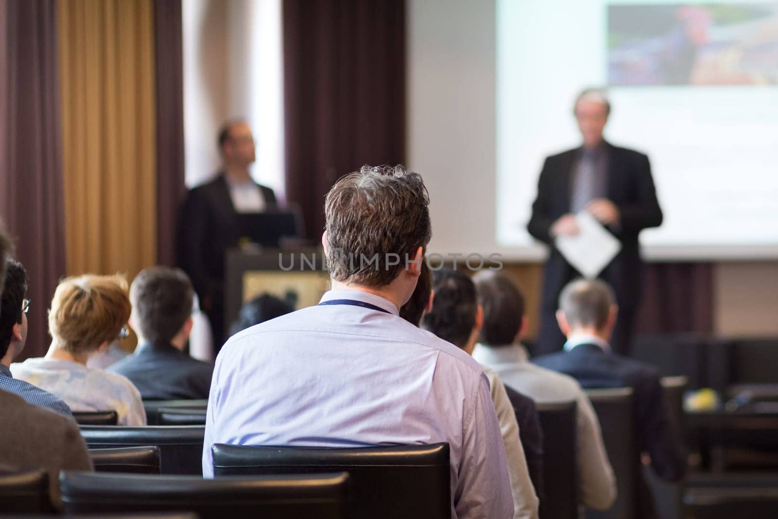 Speaker Giving a Talk at Business Meeting. Audience in the conference hall. Business and Entrepreneurship.