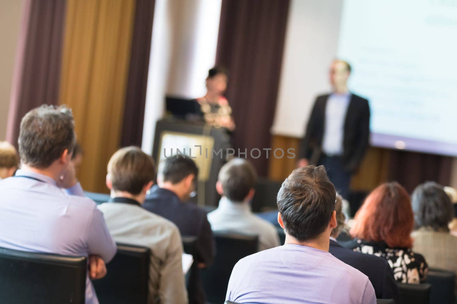 Speaker Giving a Talk at Business Meeting. Audience in the conference hall. Business and Entrepreneurship.