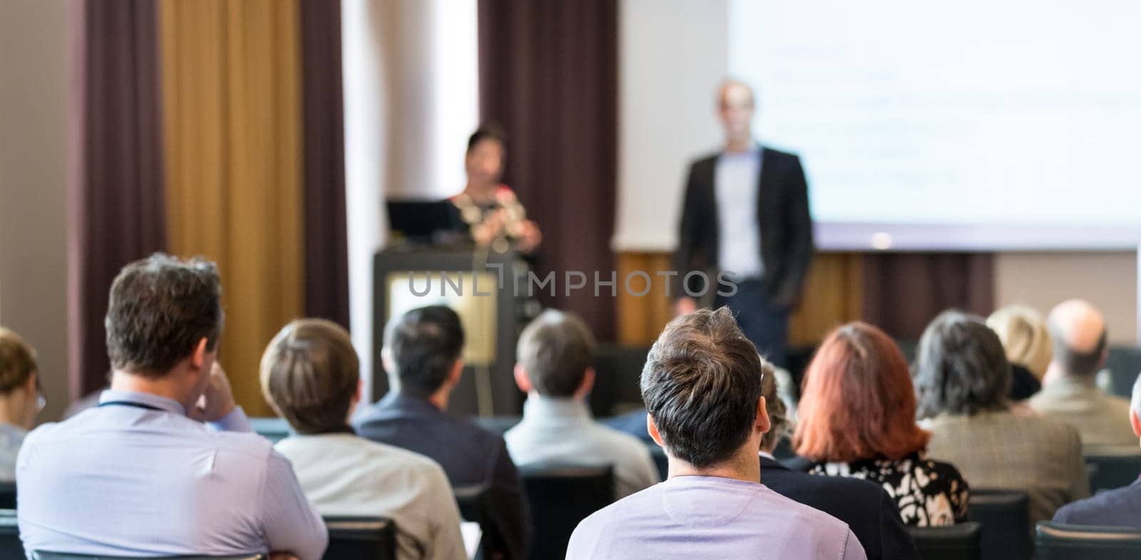 Speaker Giving a Talk at Business Meeting. Audience in the conference hall. Business and Entrepreneurship.