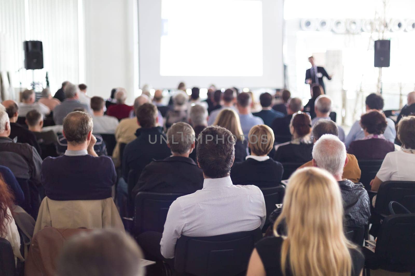 Speaker Giving a Talk at Business Meeting. Audience in the conference hall. Business and Entrepreneurship.