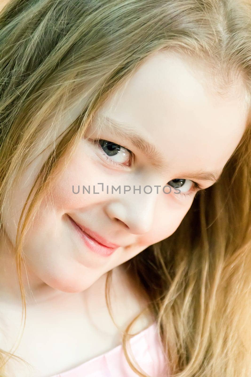 Portrait of cute girl with blond hair
