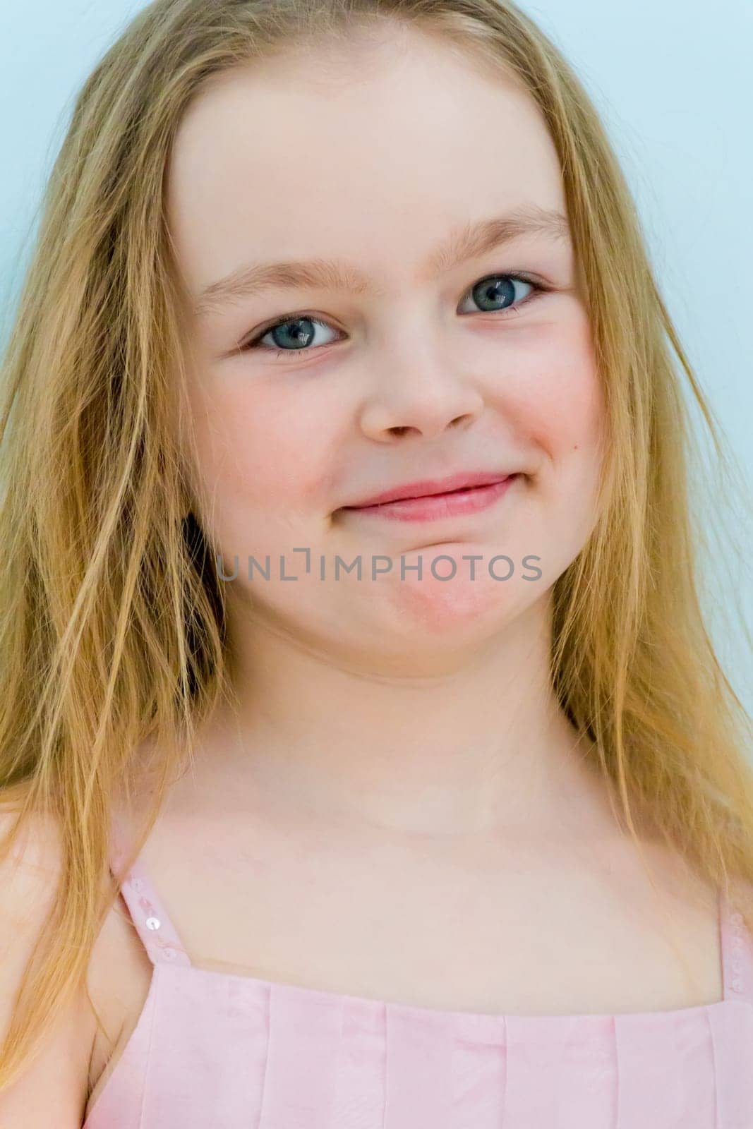 Portrait of cute girl with blond hair