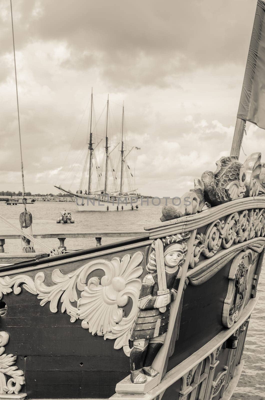 Old sailboat in the harbor, sepia