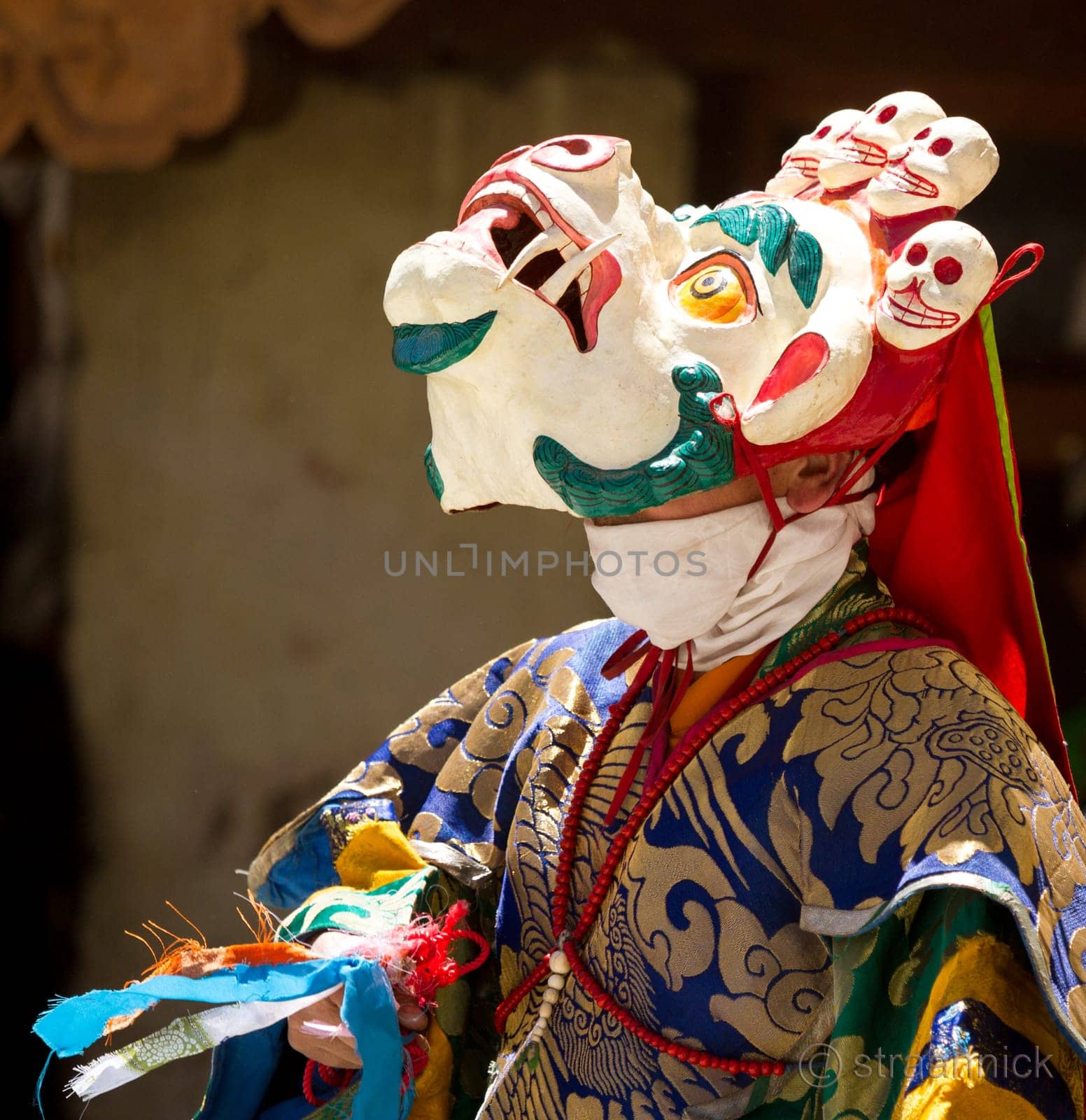 KARSHA, INDIA - JUL 17: unidentified monk performs a religious mask dance during the Cham Dance Festival on Jul 17, 2012 in Karsha, India.