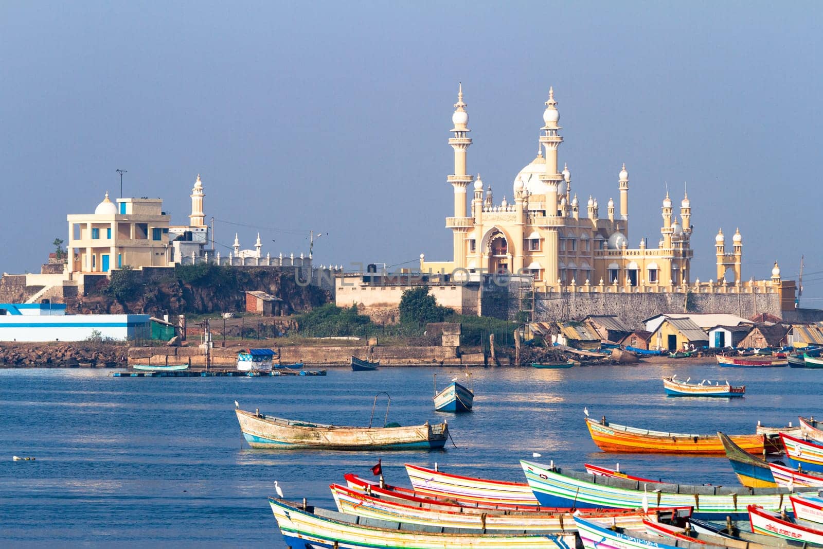 fishing harbour with mosque in the background (Arabian Sea, Kerala, India)