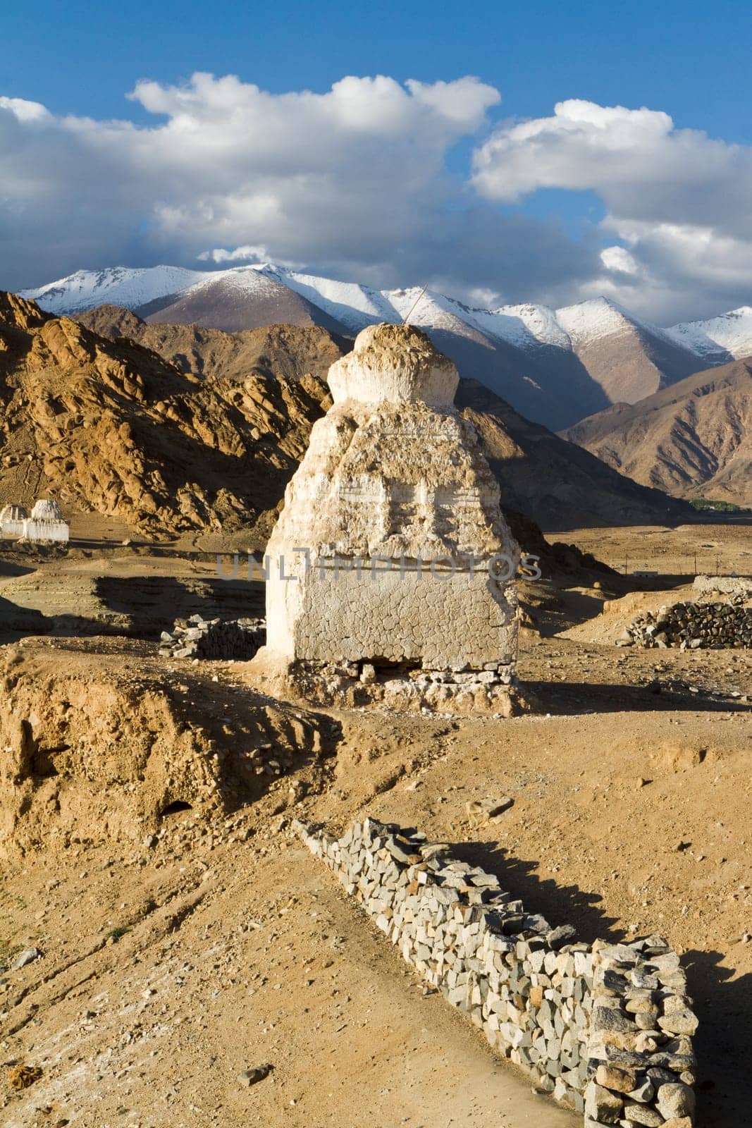 Buddhist stupas near the Shey monastery against the Himalayas mountains (Ladakh, north India)
