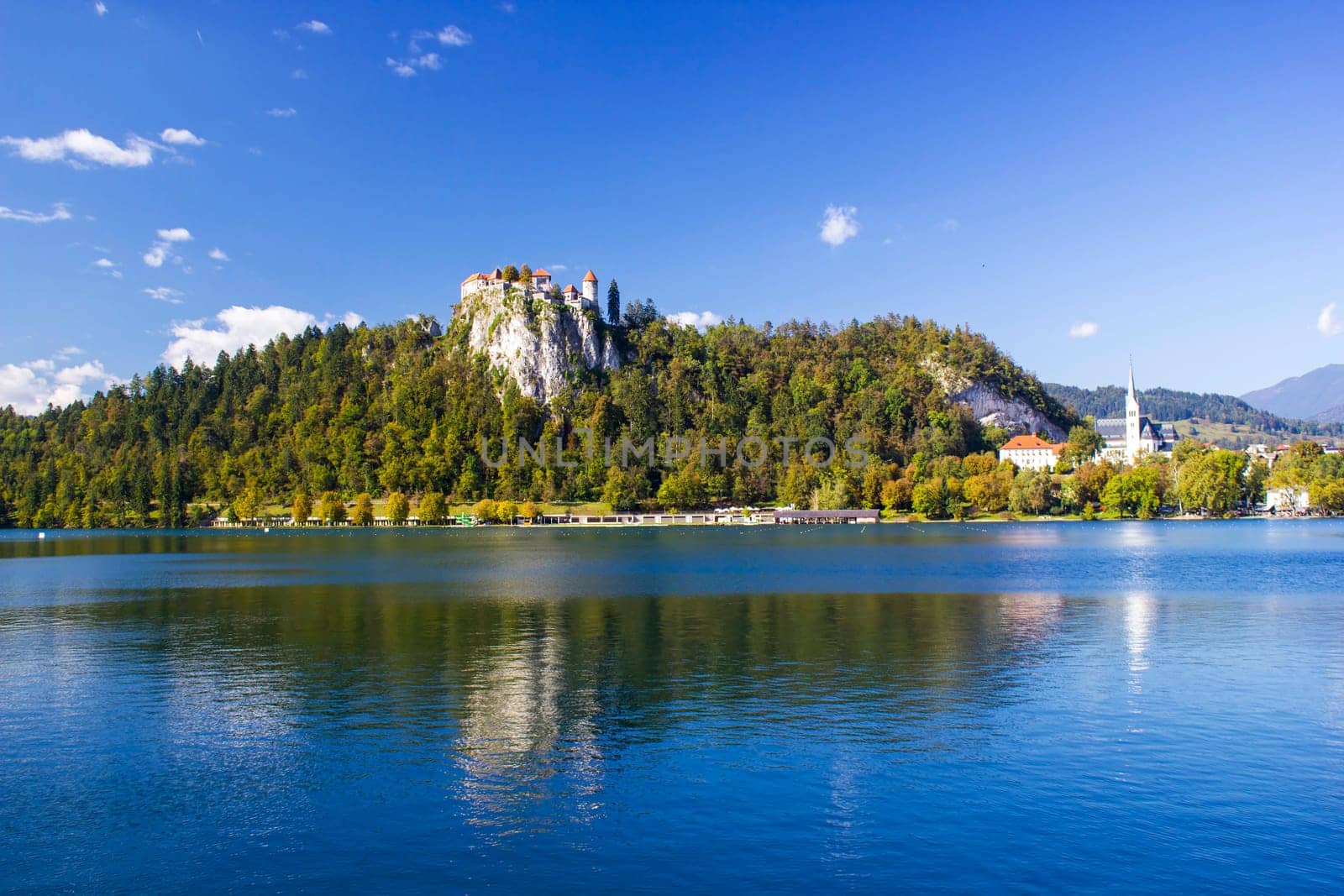 Colorful Bled in fall, with the rock top castle, Slovenia