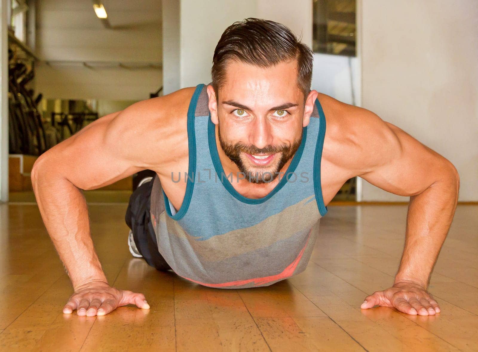 Young man makes push-up