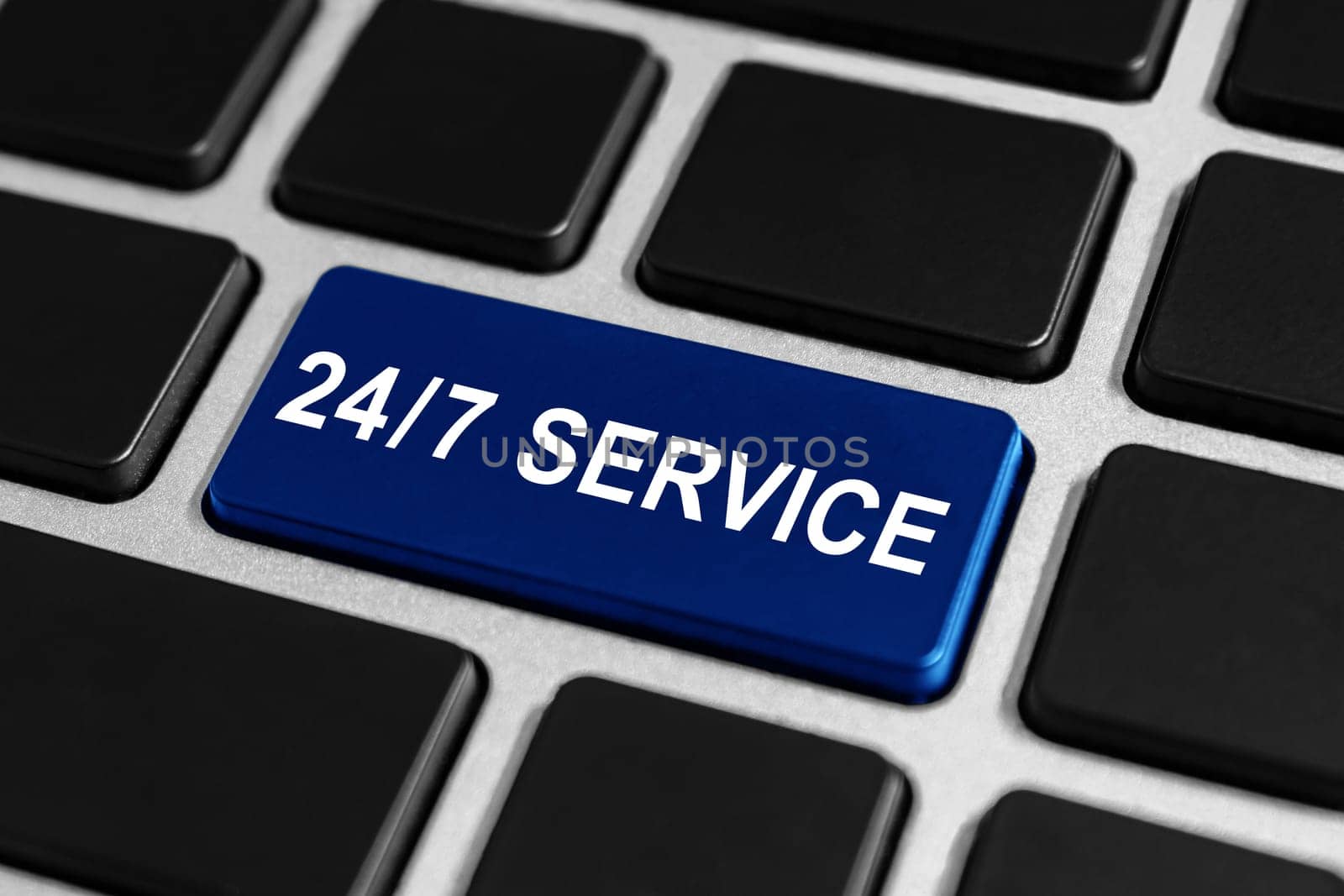 24/7 service blue button on keyboard, business concept